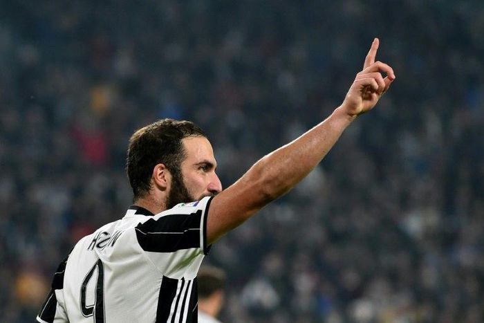 Juventus' forward Gonzalo Higuain celebrates after scoring a goal in Turin on October 29, 2016