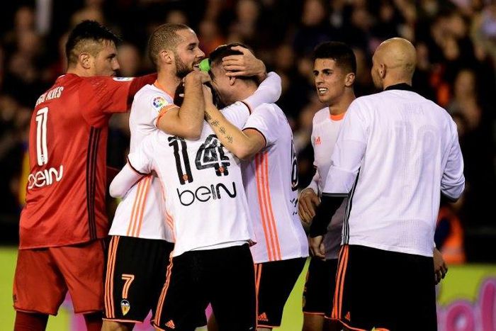 Valencia's players celebrates after their Spanish league football match against Real Madrid at the Mestalla stadium in Valencia on February 22, 2017