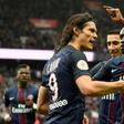 Paris Saint-Germain's Edinson Cavani (L) is congratulated by teammates after scoring a goal during their French L1 football match against Montpellier at the Parc des Princes stadium in Paris on April 22, 2017