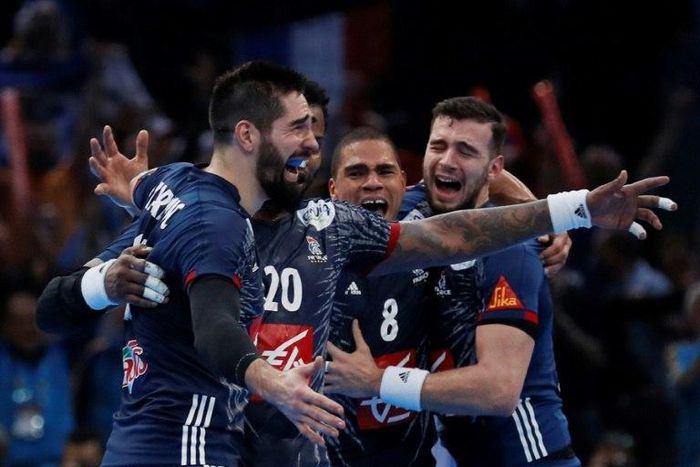 (From L) France's centre back Nikola Karabatic, France's centre back Daniel Narcisse and France's right back Nedim Remili celebrate after winning the 25th IHF Men's World Championship 2017 final handball match between France and Norway