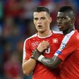 Swiss midfielder Granit Xhaka (left) has been sent off eight times for club and country since April 2014