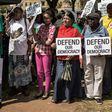 People rally outside the South African National Treasury on April 3, 2017, in Pretoria