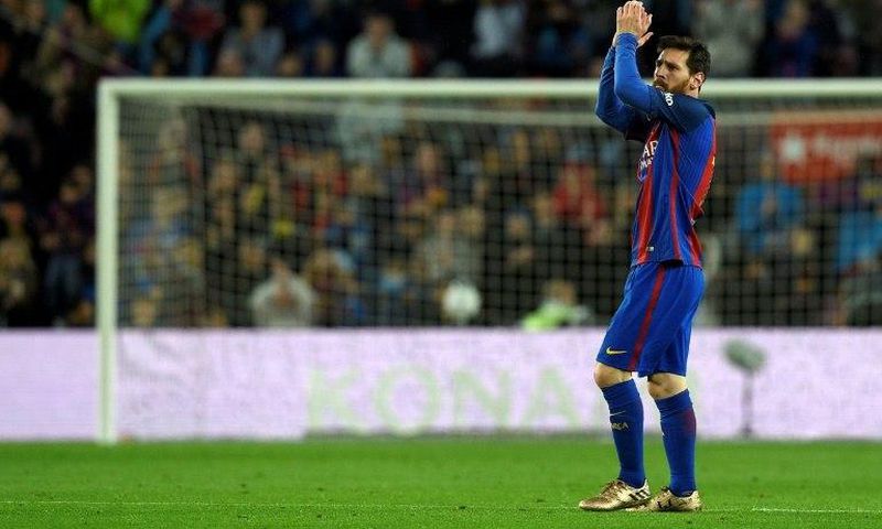 Barcelona's forward Lionel Messi celebrates after scoring a goal during the Spanish league football match against Osasuna April 26, 2017