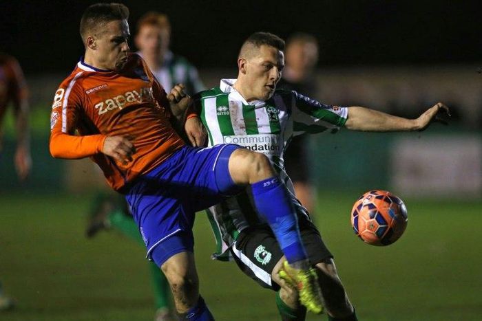Birmingham City's English defender Mitch Hancox (left) vies with Blyth Spartans' English striker Daniel Maguire during their English FA Cup match in Blyth on January 3, 2015