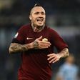Roma's Radja Nainggolan celebrates after scoring during the Serie A match against Lazio at the Olympic Stadium in Rome, on December 4, 2016