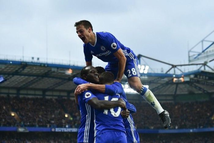 Chelsea's Cesar Azpilicueta (up) celebrates with teammates after Eden Hazard scores a goal during their English Premier League match against Manchester United, at Stamford Bridge in London, on October 23, 2016