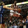 Dirk Nowitzki (L) of the Dallas Mavericks knocks the ball away from Rajon Rondo of the Chicago Bulls, at the United Center in Chicago, Illinois, on January 17, 2017