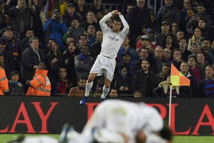 Real Madrid's forward Cristiano Ronaldo celebrates after scoring a goal against in Barcelona on April 2, 2016