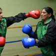 19-year-old Pakistani boxer Razia Banu (L) throws a punch at her mother Haleema Abdul Aziz during a practice session at the Pak Shaheen Boxing Club in Karachi