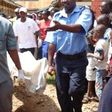 The remains of the deceased being removed by the police