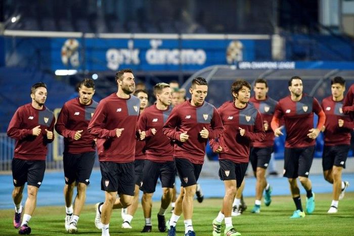 Sevilla's players run during a training session at the Maksimir stadium in Zagreb, on October 17, 2016