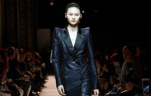 A model wearing one of Mugler's fearsome power suits