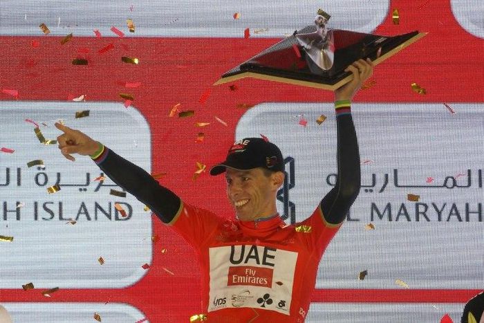 Portugal's Rui Costa, wearing the overall leader red jersey, celebrates on stage after winning the final Yas Island stage of the Tour of Abu Dhabi, on February 26, 2017