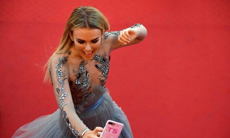 British singer Tallia Storm, who has 213,000 Instagram followers, poses for selfies on the red carpet at Cannes
