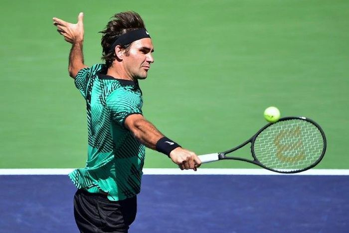 Roger Federer of Switzerland hits a backhand return to Jack Sock of the US in their men's semifinal ATP Indian Wells Masters in Indian Wells, California on March 18, 2017