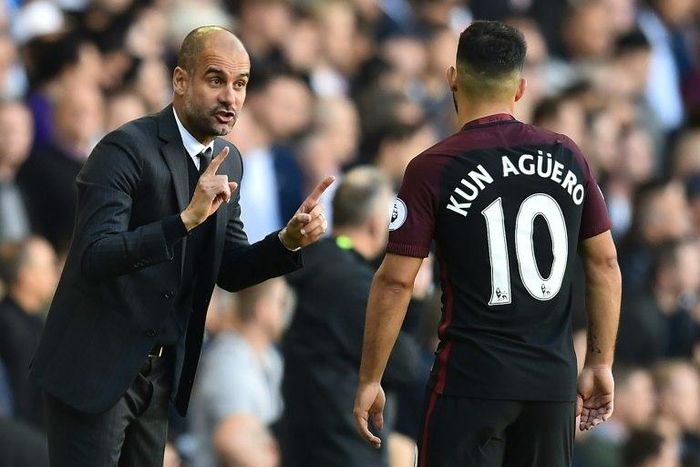 Manchester City's manager Pep Guardiola (L) gestures to Manchester City's Argentinian striker Sergio Aguero during the English Premier League football match between Tottenham Hotspur and Manchester City