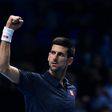 Serbia's Novak Djokovic celebrates beating Japan's Kei Nishikori during their men's semi-final singles match on day seven of the ATP World Tour Finals tennis tournament in London on November 19, 2016