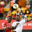 Ghana's forward Asamoah Gyan (R) heads the ball with Uganda's midfielder Tony Mawejje during the 2017 Africa Cup of Nations group D football match between Ghana and Uganda in Port-Gentil on January 17, 2017