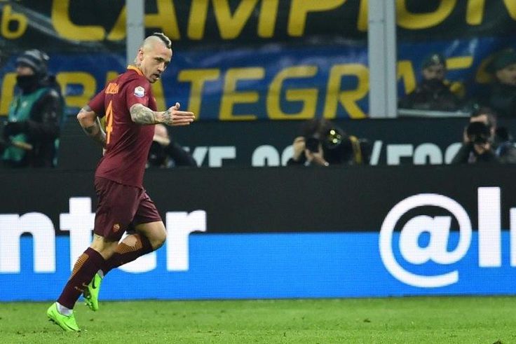 AS Roma's midfielder Radja Nainggolan celebrates after scoring a goal on February 26, 2017