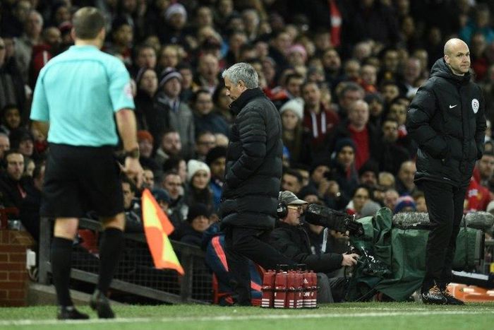 Manchester United's manager Jose Mourinho (C) leaves the touchline after referee Jonathan Moss sent him to the stands during the English Premier League football match between Manchester United and West Ham United on November 27, 2016