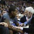 Head coach Gregg Popovich of the San Antonio Spurs talks to Kawhi Leonard during a NBA game in Sacramento, California
