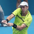 Gilles Muller of Luxembourg hits a return to Pablo Cuevas of Uruguay in their men's quarter-final match at the Sydney International tennis tournament, on January 12, 2017