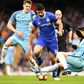 Chelsea's striker Diego Costa (C) vies with Manchester City's defender John Stones (L) and defender Nicolas Otamendi during the English Premier League football match December 3, 2016