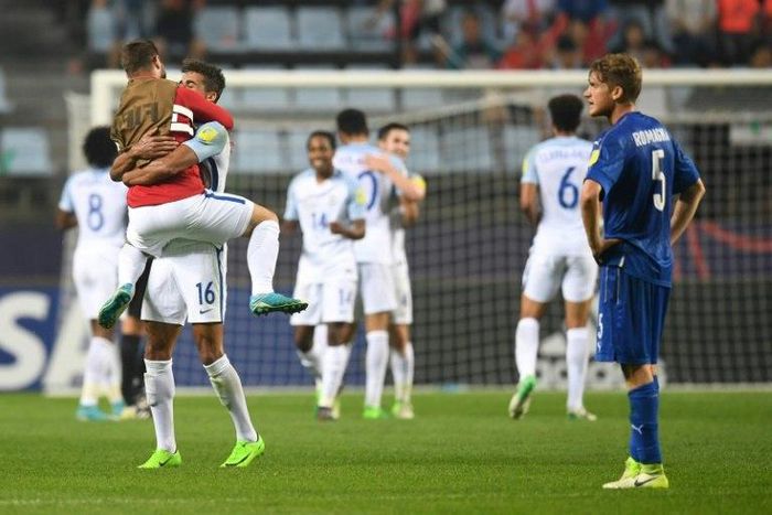 England's players (white) celebrate their victory during the U-20 World Cup semi-final football match between England and Italy in Jeonju, South Korea