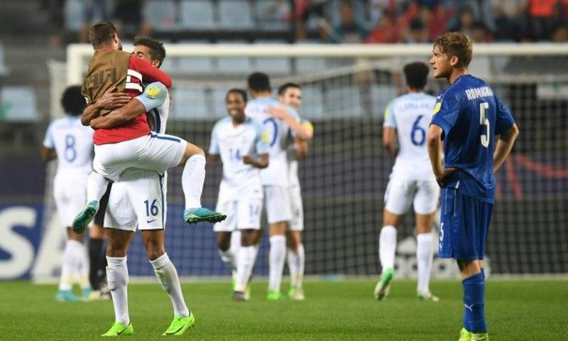 England's players (white) celebrate their victory during the U-20 World Cup semi-final football match between England and Italy in Jeonju, South Korea