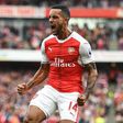 Arsenal's Theo Walcott celebrates after scoring a goal during their English Premier League match against Swansea City, at the Emirates Stadium in London, on October 15, 2016