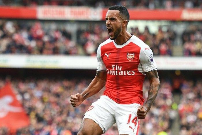 Arsenal's Theo Walcott celebrates after scoring a goal during their English Premier League match against Swansea City, at the Emirates Stadium in London, on October 15, 2016