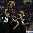 Chelsea's Pedro (R) celebrates with teammates after scoring their third goal against Leicester City at King Power Stadium in Leicester, central England on January 14, 2017