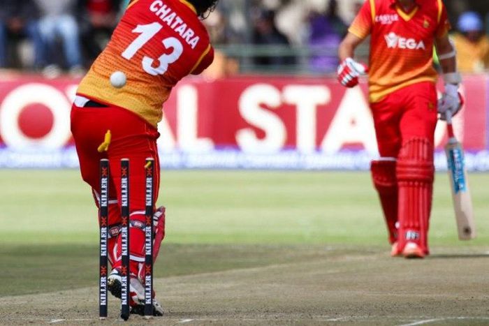 Zimbabwe's batsman Tendai Chatara (L) looses his wicket during the second cricket match between India and hosts Zimbabwe in a series of 3 ODI games at Harare Sports Club, on June 13, 2016