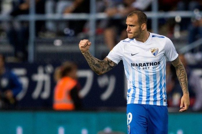 Malaga's forward Sandro Ramirez celebrates after scoring during the Spanish league football match Malaga CF vs Sevilla FC at La Rosaleda stadium in Malaga on May 1, 2017