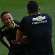 Brazil's footballer Neymar (L) jokes with teammate Renato Augusto during a training session at Mineirao stadium in Belo Horizonte, Minas Gerais, Brazil, on November 8, 2016