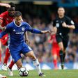 Chelsea's Belgian midfielder Eden Hazard vies with Leicester City's Ghanaian midfielder Daniel Amartey during their English Premier League match in London on October 15, 2016