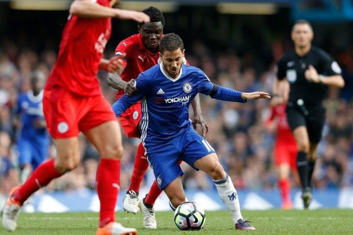 Chelsea's Belgian midfielder Eden Hazard vies with Leicester City's Ghanaian midfielder Daniel Amartey during their English Premier League match in London on October 15, 2016
