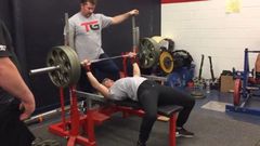 132-Pound Woman Bench Presses.
