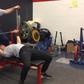 132-Pound Woman Bench Presses.