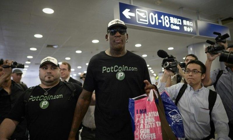 Former NBA player Dennis Rodman arrives to check-in for his flight to North Korea, at Beijing's international airport, on June 13, 2017