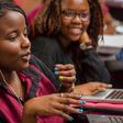 Female African student speaking in a classroom