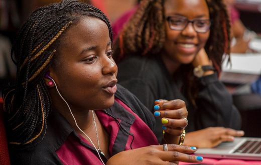 Female African student speaking in a classroom