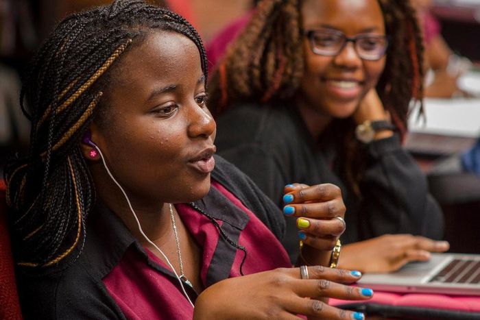 Female African student speaking in a classroom