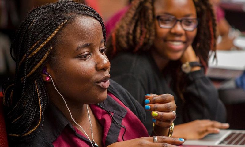 Female African student speaking in a classroom