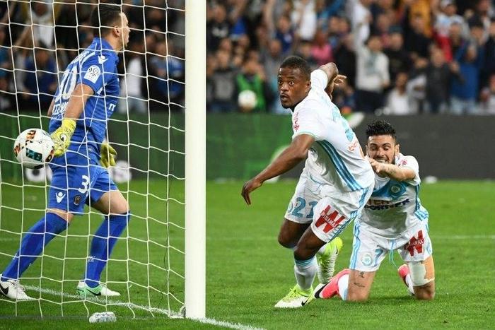 Olympique de Marseille French defender Patrice Evra (2nd R) scores the second goal during the French L1 football match between Olympique of Marseille and Nice at the Velodrome stadium in Marseille, on May 7, 2017
