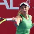 Denmark's Caroline Wozniacki hits a return against France's Kristina Mladenovic during their women's final match at the Hong Kong Open on October 16, 2016