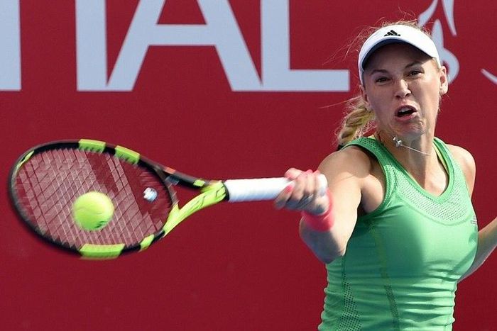 Denmark's Caroline Wozniacki hits a return against France's Kristina Mladenovic during their women's final match at the Hong Kong Open on October 16, 2016