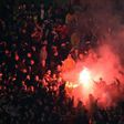 Liverpool supporters light flares during their Europa League clash with Manchester United at Old Trafford on March 17, 2016