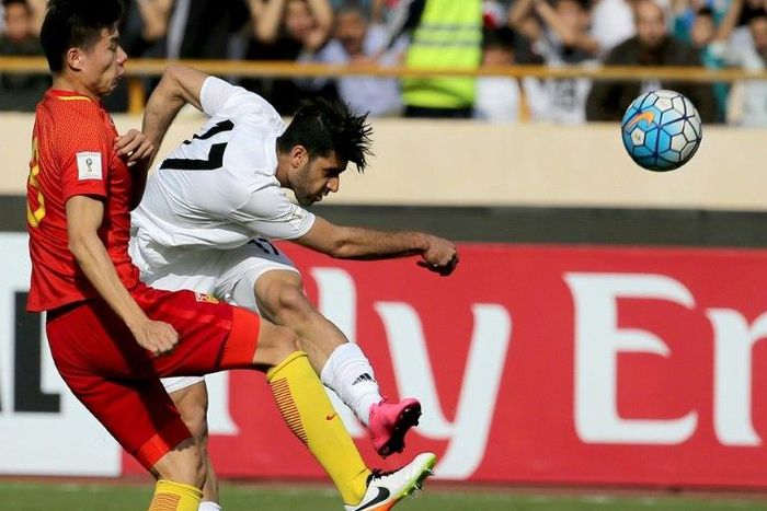 Iran's Mehdi Taremi (right) in action against China during a 2018 World Cup qualifier in Tehran on March 28, 2017