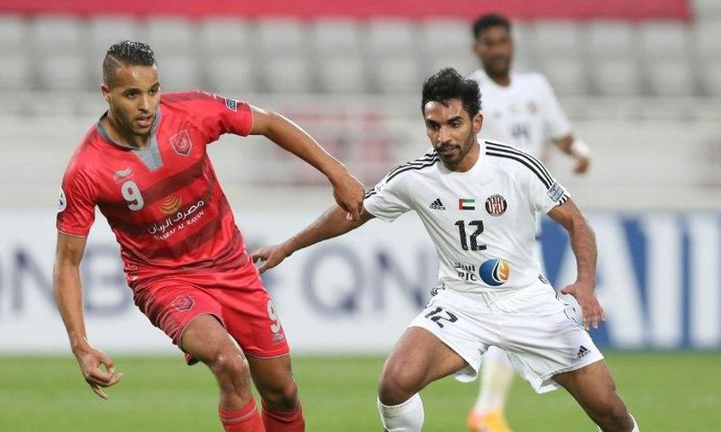 UAE's Al-Jazira player Salim Rashid (R) fights for the ball with Qatar's Lekhwiya player Youssef Al-Arabi during the Asian Champions League football match between Lekhwiya SC and Al-Jazira Club on February 20, 2017